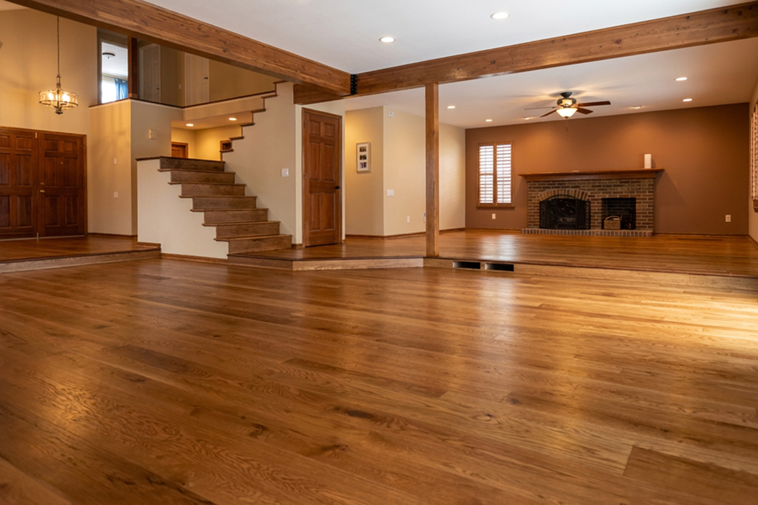 Warm brown hardwood floor finished with layered PALLMANN Natural and Brown colors