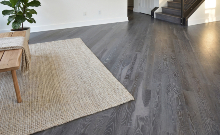 Gray-brown hardwood floor with visible grain variation after Rubio Monocoat Fumed and White 5% oil